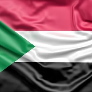 Image du drapeau du Soudan, composé de trois bandes horizontales rouge, blanche et noire, avec un triangle vert à la hampe
